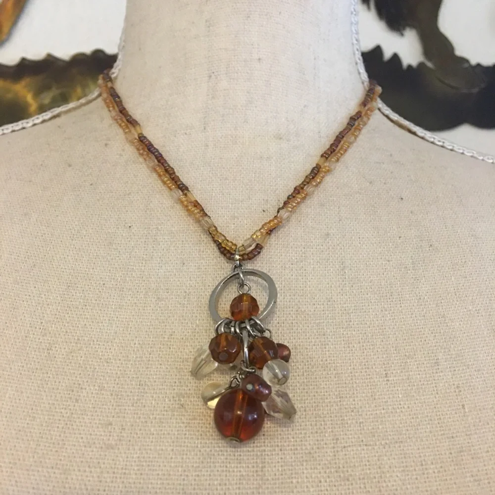Glass bead pendant on seed bead strand necklace